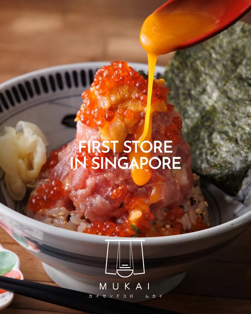 MUKAI seafood donburi topped with tuna sashimi, ikura and egg yolk