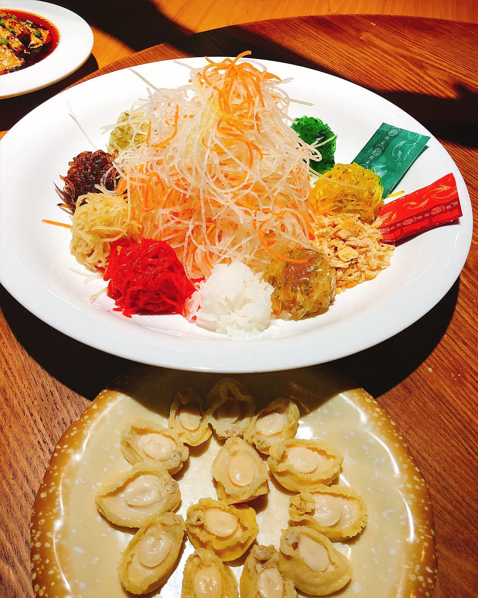 A colorful and vibrant Yusheng platter ready for tossing