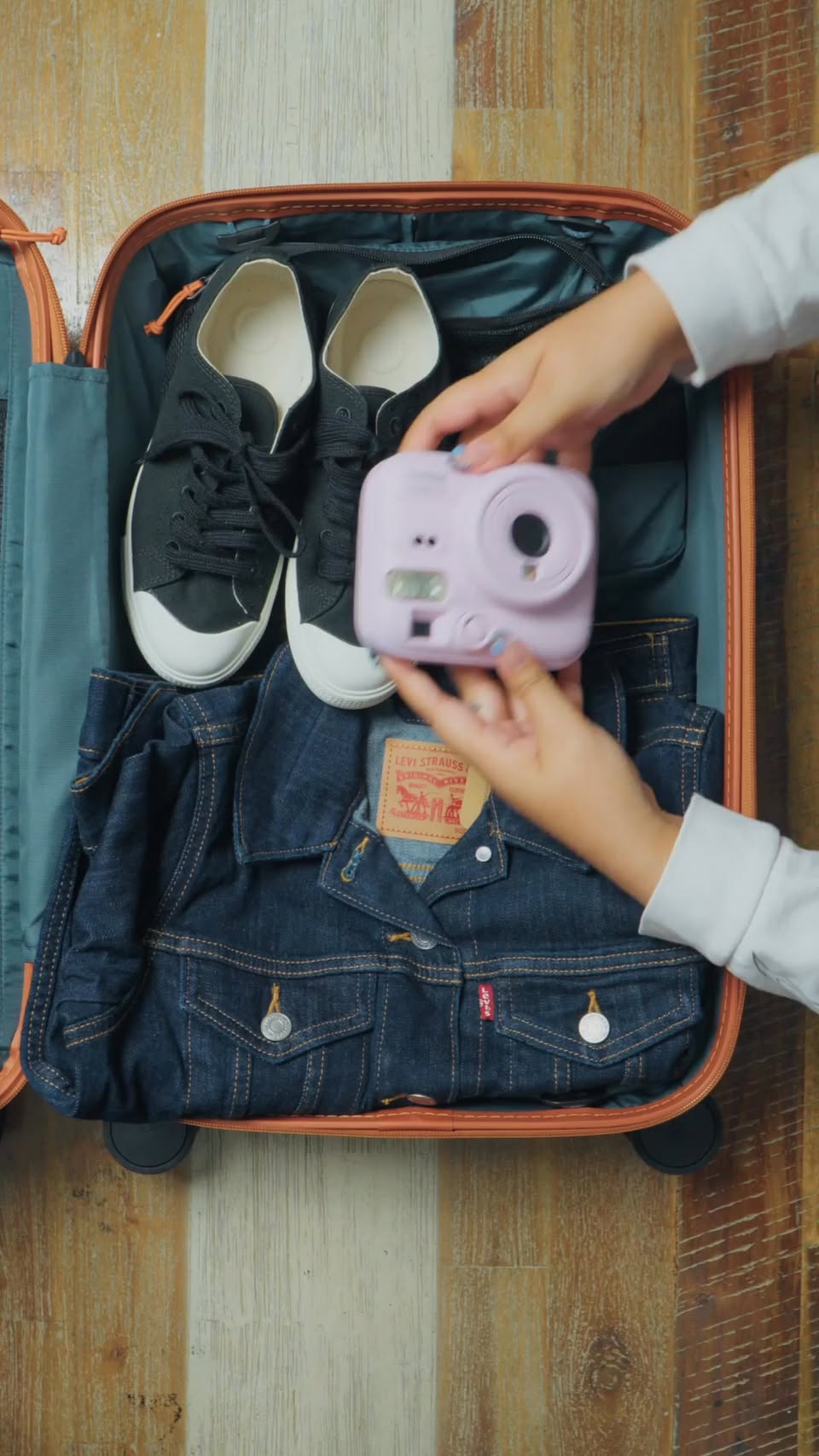 June travel essentials display at Plaza Singapura with bags jackets and accessories