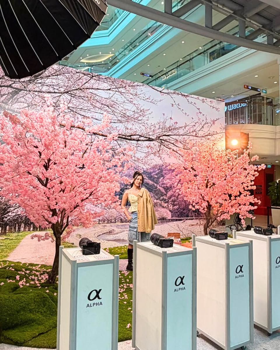 A general view of a lively event space, filled with photography enthusiasts.