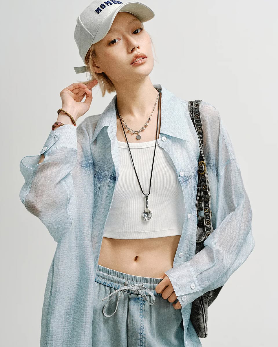 A minimalist pinstripe blazer styled for a modern urban look.