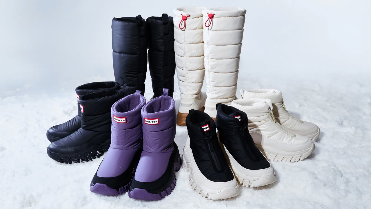 Close-up of Hunter Boots winter footwear and a cozy puffy bag.