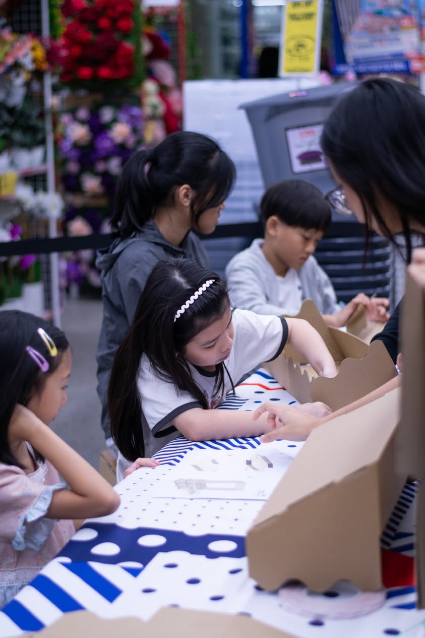 Children engaged in crafting at an eco toy workshop