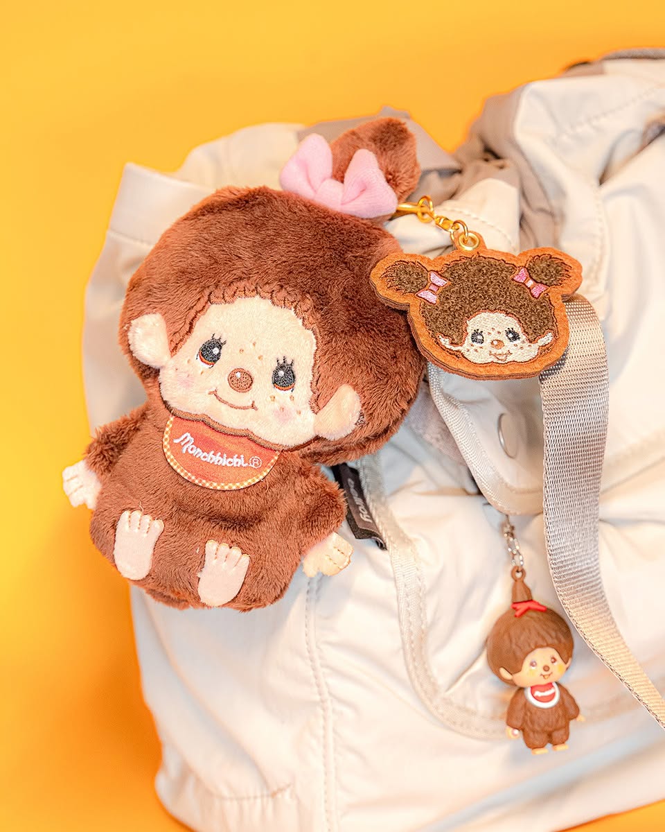 A stylish tote bag decorated with colorful accessories