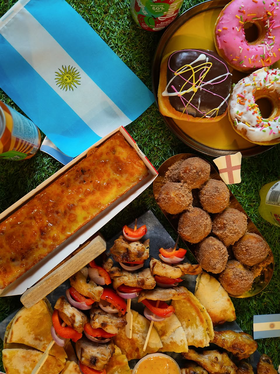 Assorted pastries and donuts with Argentine flag