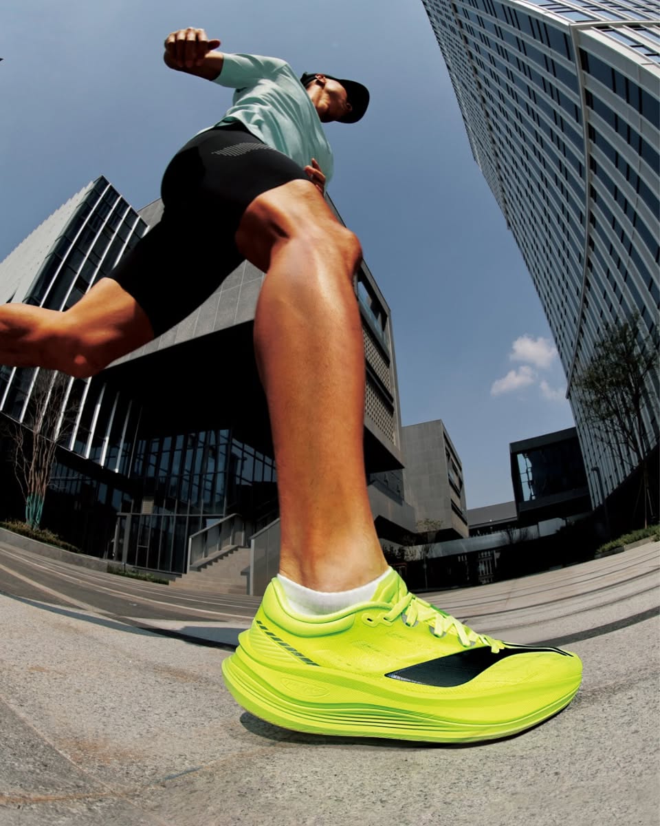 Person running in athletic shoes with vibrant colors