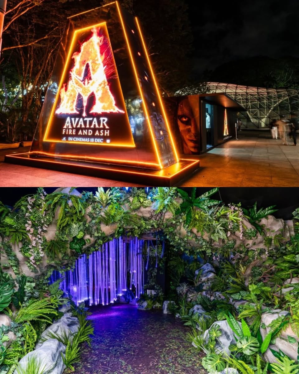 Visitors exploring the Avatar: Fire and Ash experience booth, featuring themed backdrops.