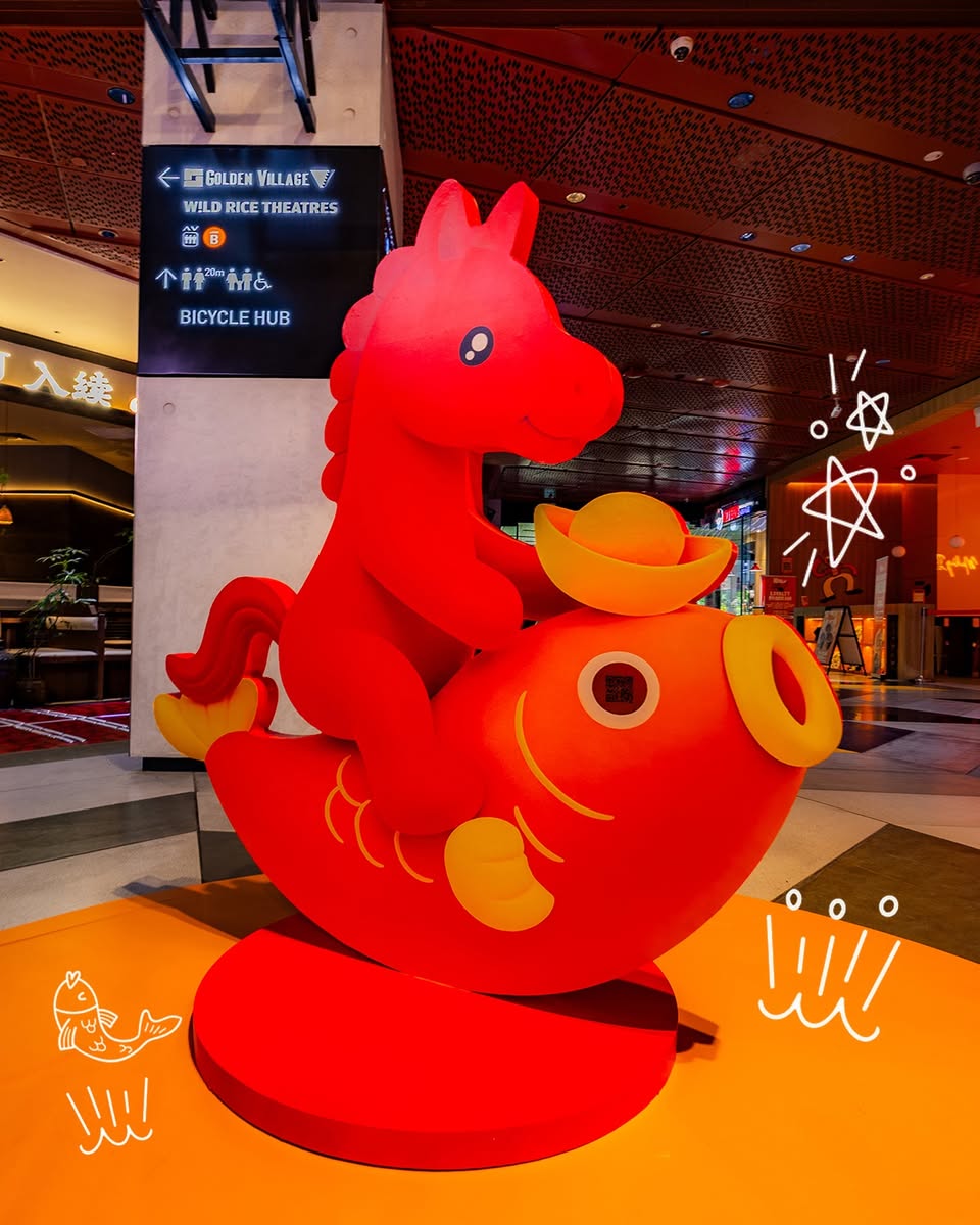 A dazzling rotating horse carousel featuring vibrant Chinese New Year decorations